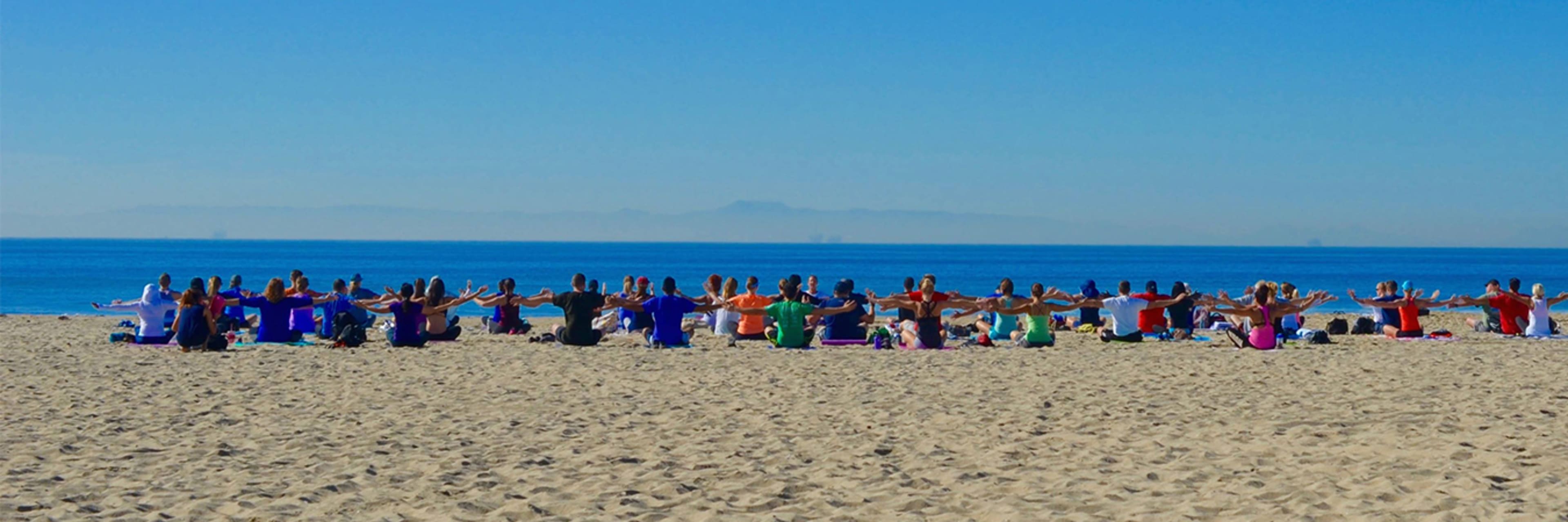 A yoga class on Huntington Beach, California.