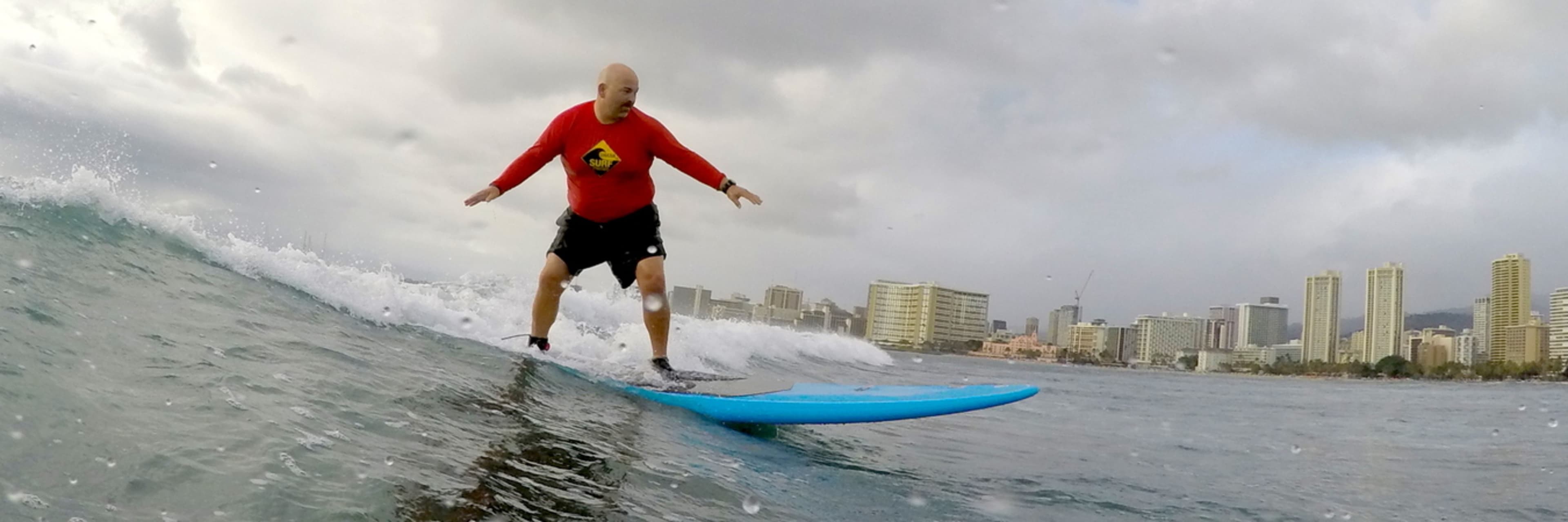 A surfer at Queen's Surf Beach, Oahu.