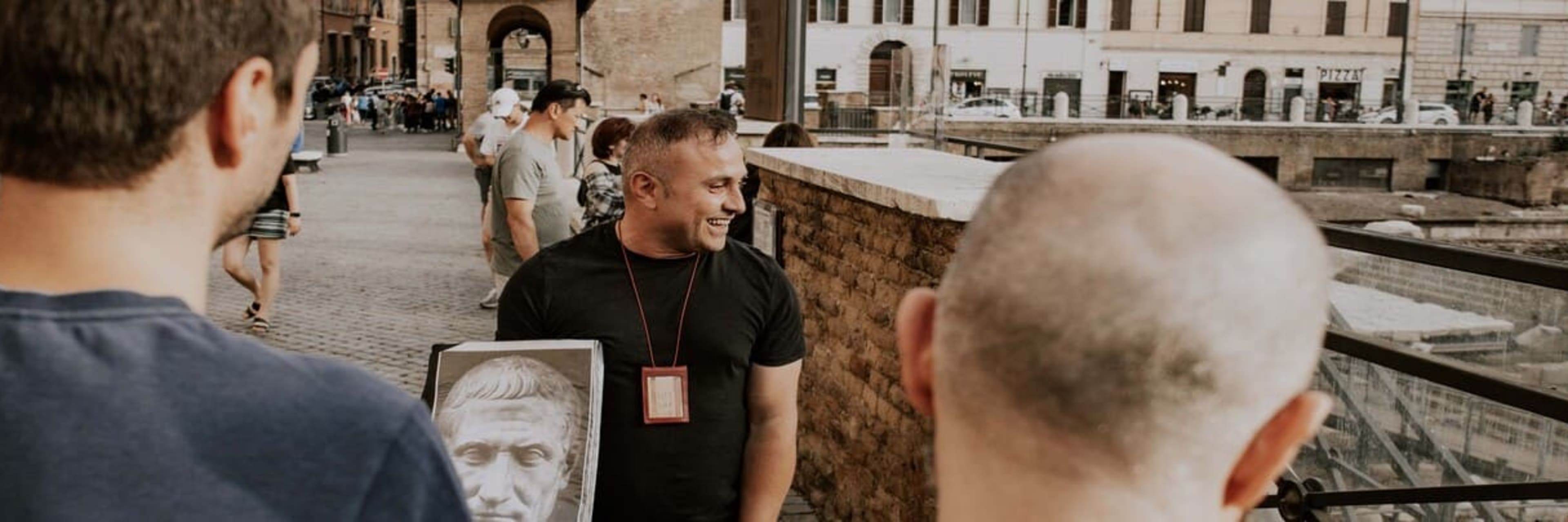 people looking at man holding portrait