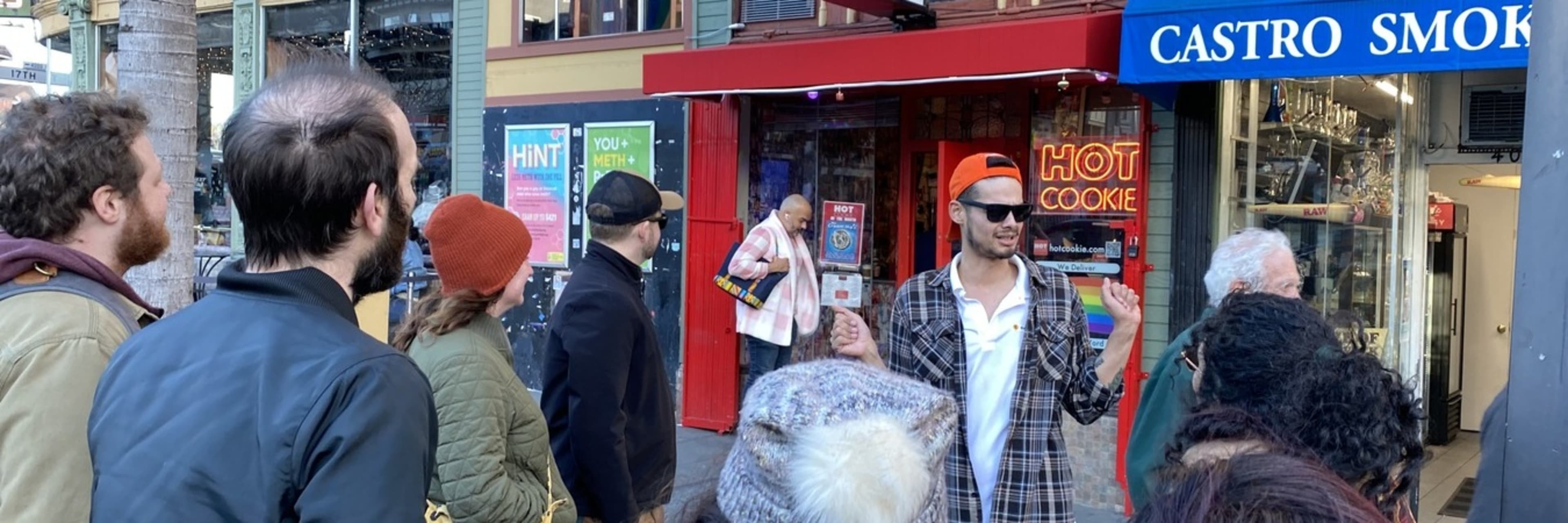 A tour guide entertaining customers in San Francisco's Castro district.