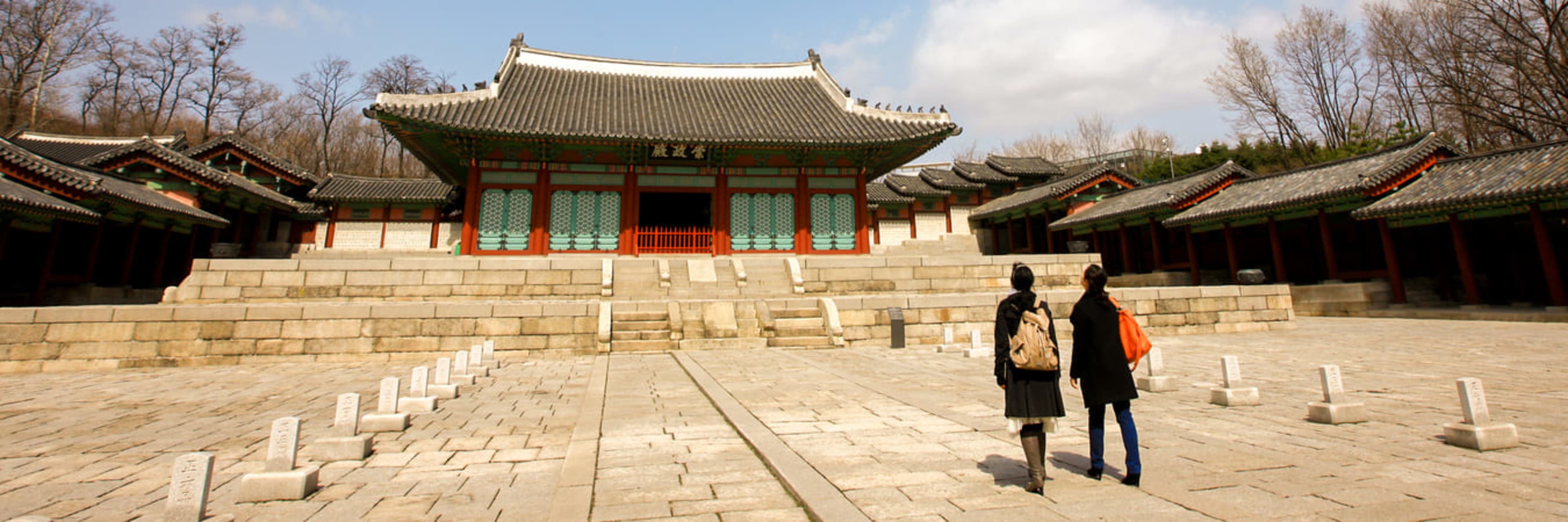 Tourists exploring Gyeonghui Palace in Seoul.