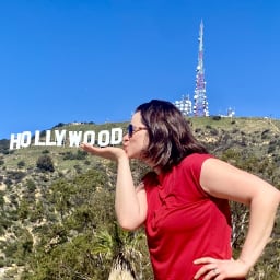 Woman  kissing the Hollywood sign