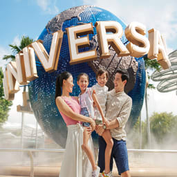 Family infront of universal sign