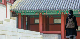 Tourist exploring Gyeonghui Palace in Seoul.