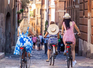 Group of friends cycling in Rome