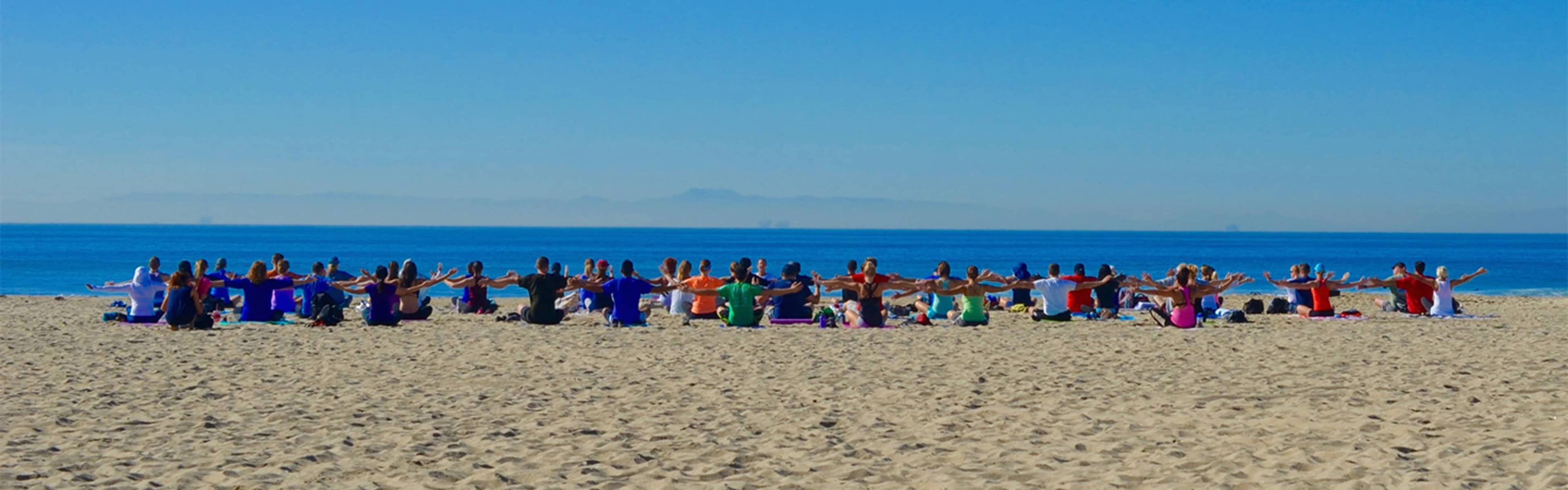 A yoga class on Huntington Beach, California.