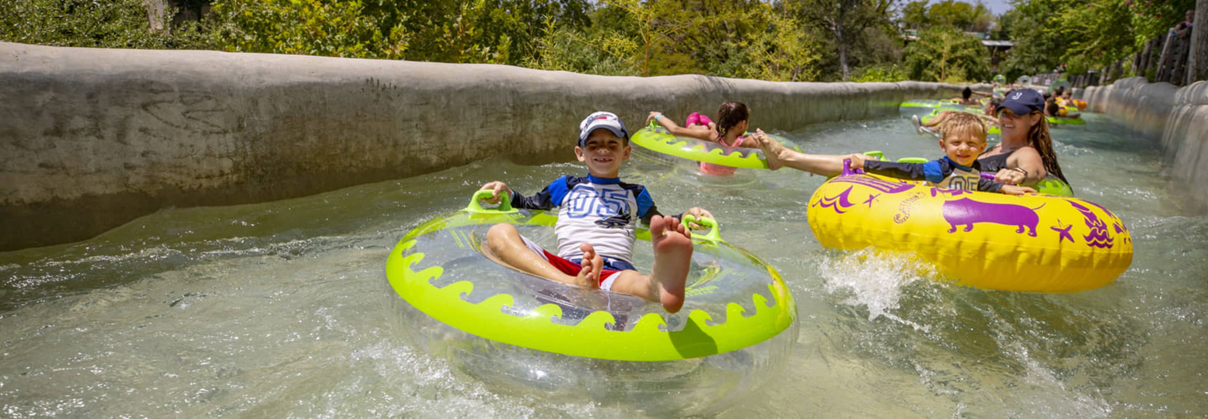 Family on a lazy river at Shlitterbahn Waterpark in New Braunfels, Texas.