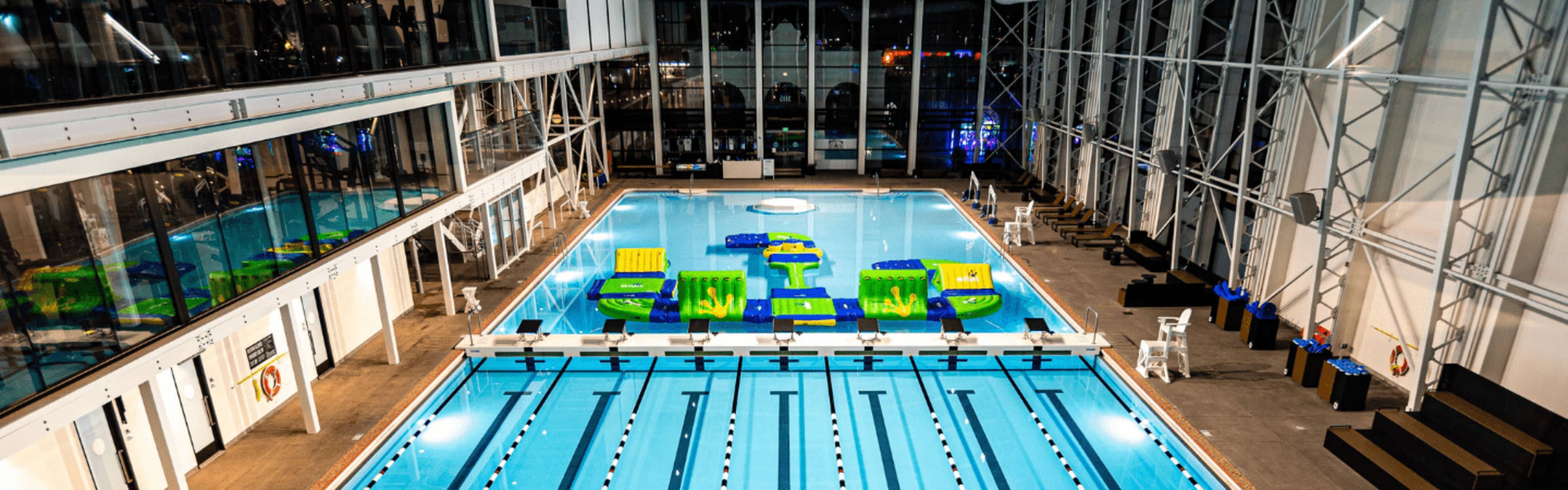 The swimming pool and floating obstacle course at Plunge San Diego.