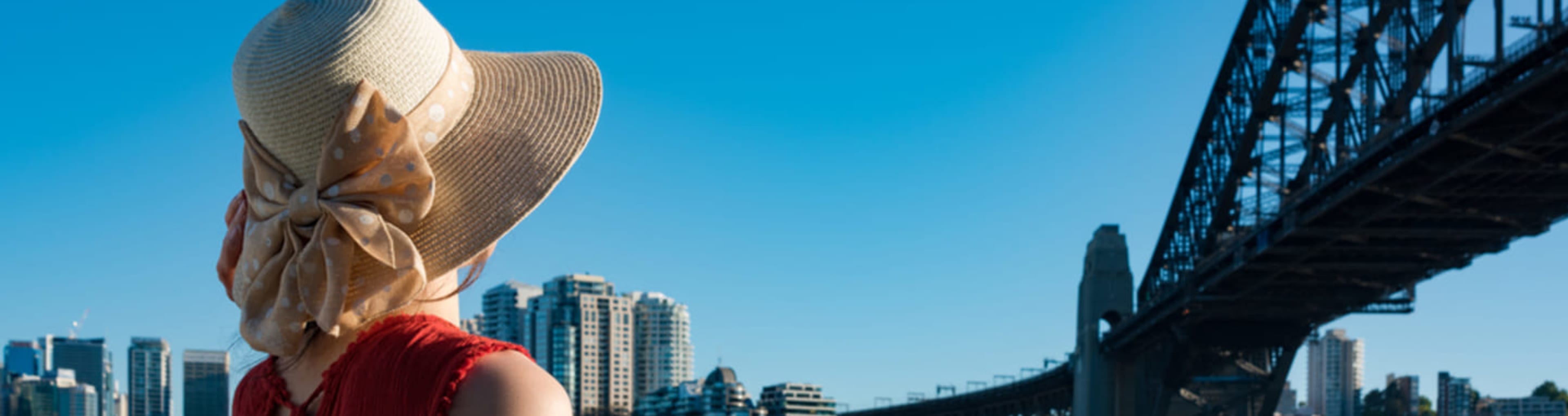 Woman gazing at Sydney Harbour Bridge