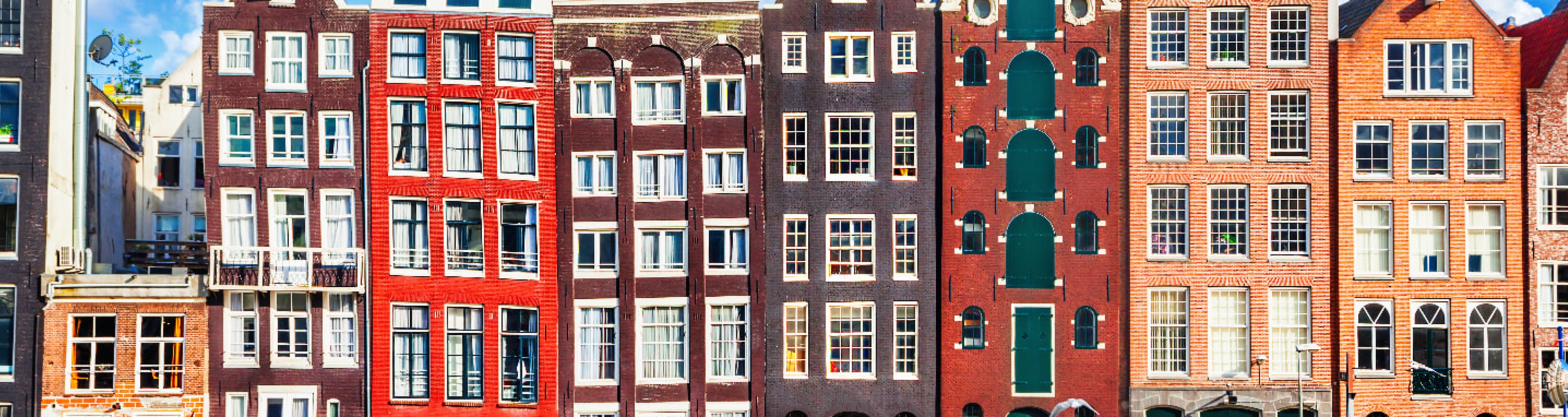 Iconic Amsterdam canal houses reflected in a canal