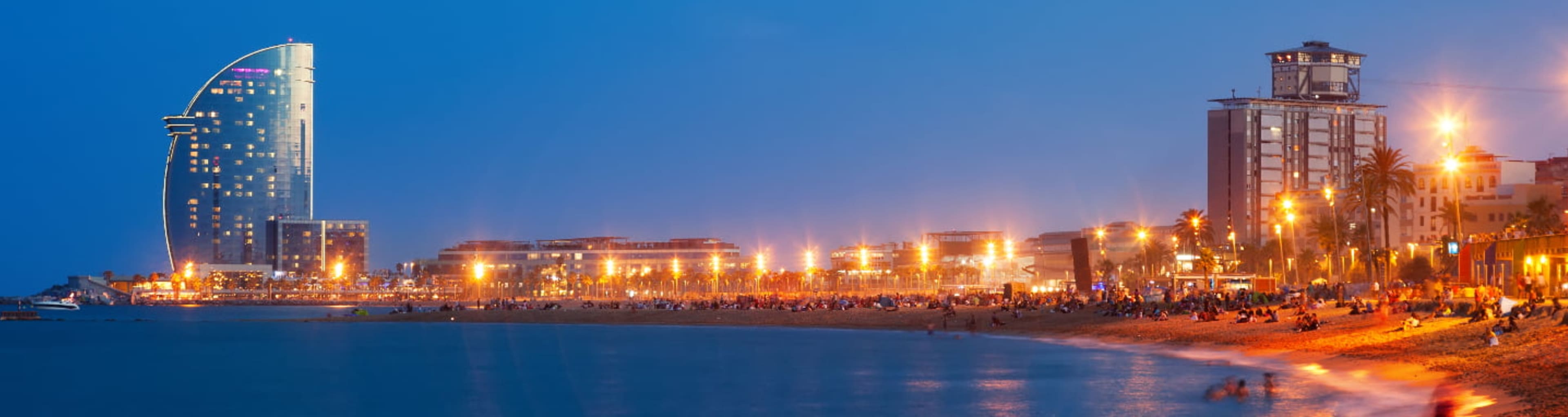 Barceloneta Beach lit up in the evening