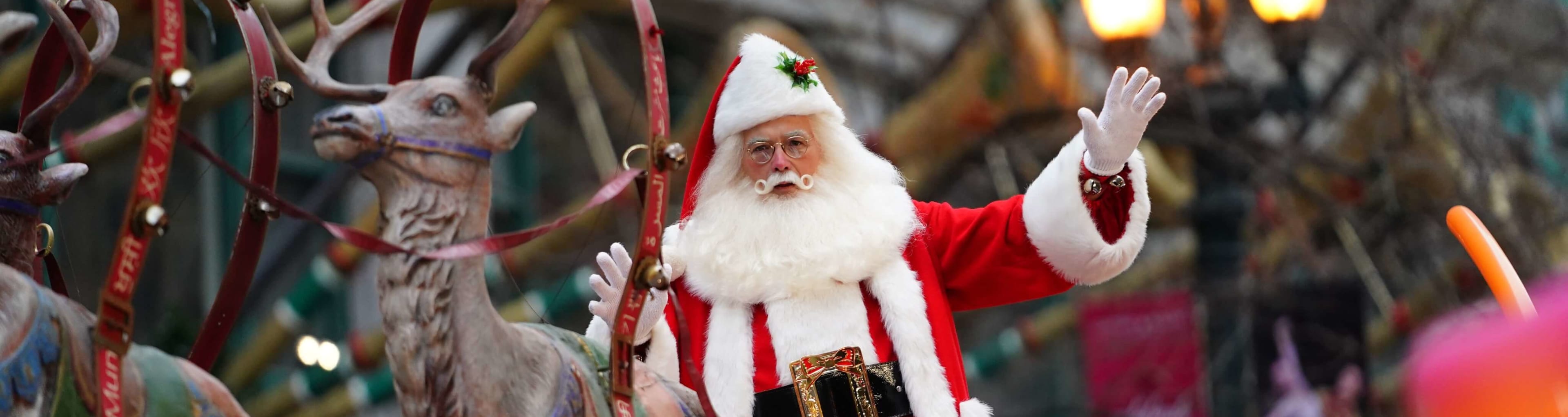 Santa Claus waving at the Chicago Christmas light switch on