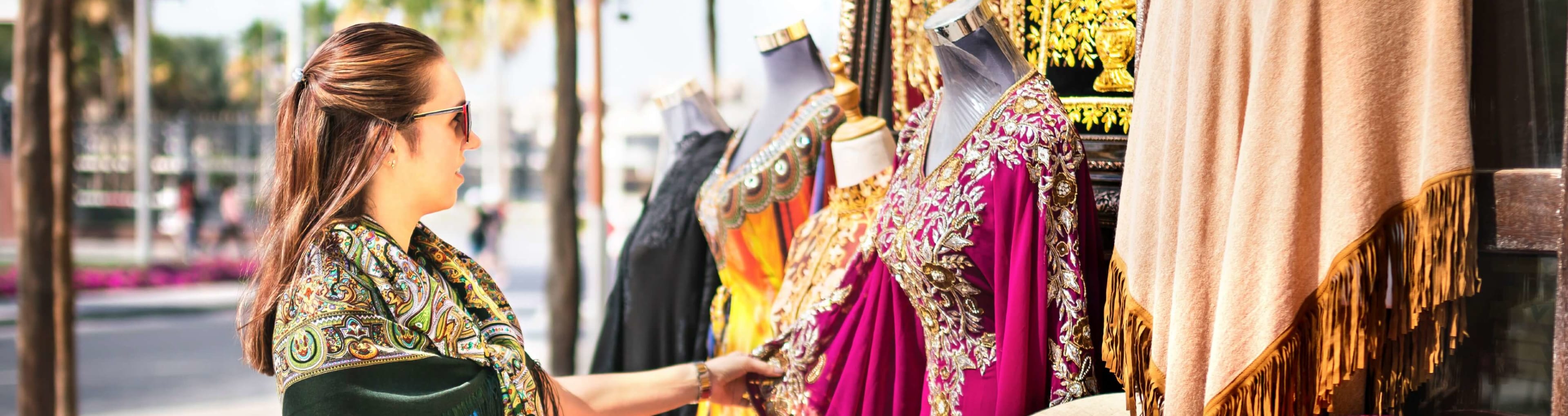 A woman shopping for clothes at a pop up market in Dubai