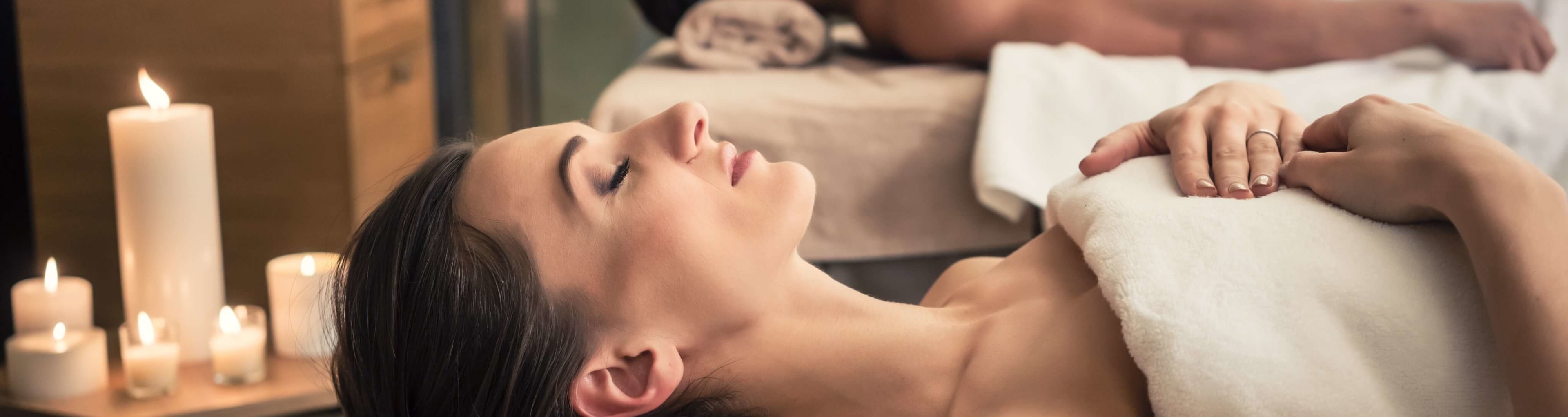 A couple relaxing on massage tables