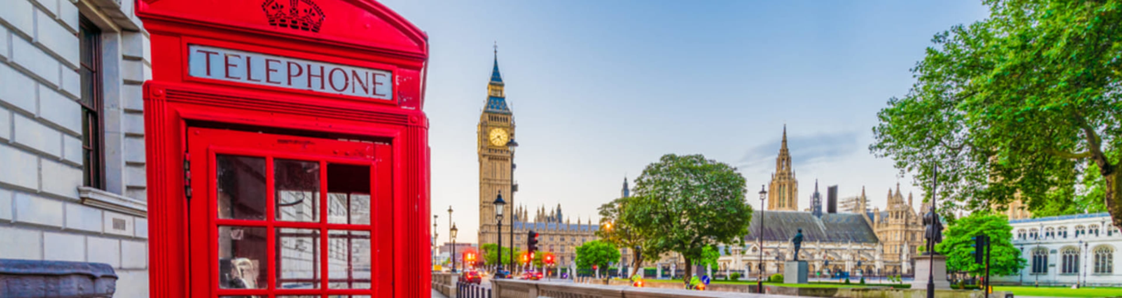 Bright red phone box in front of Big Ben and the Houses of Parliament