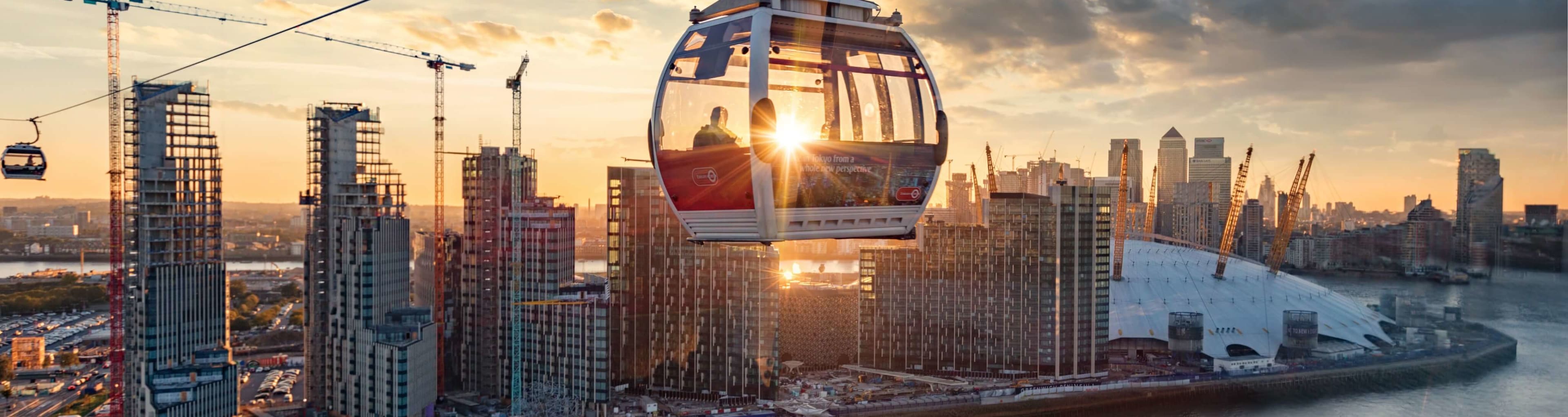 A cable car crossing the Thames at sunset