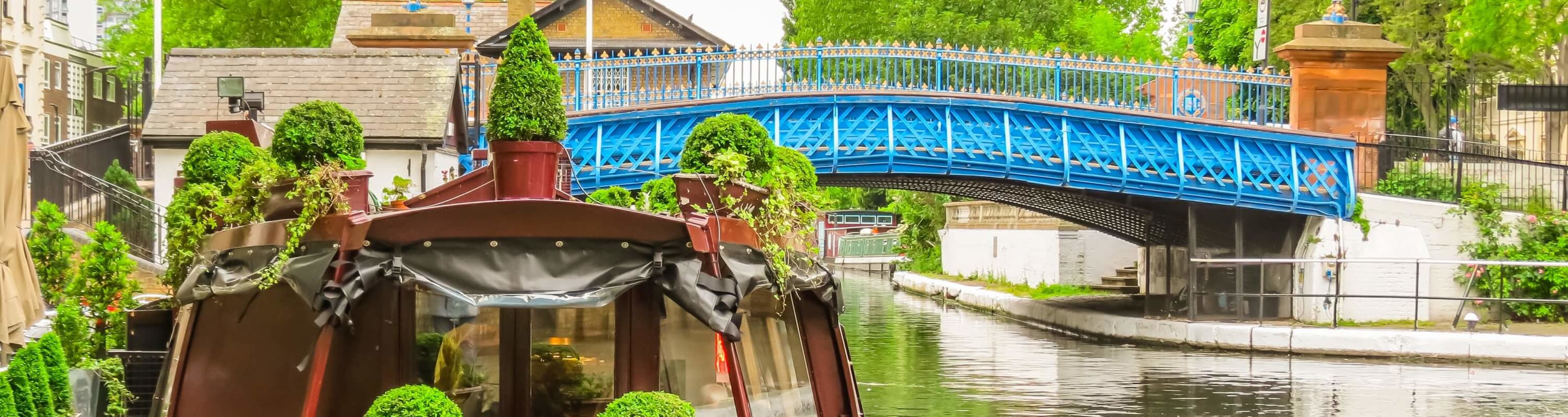 A canal boat and bridge in London's Little Venice