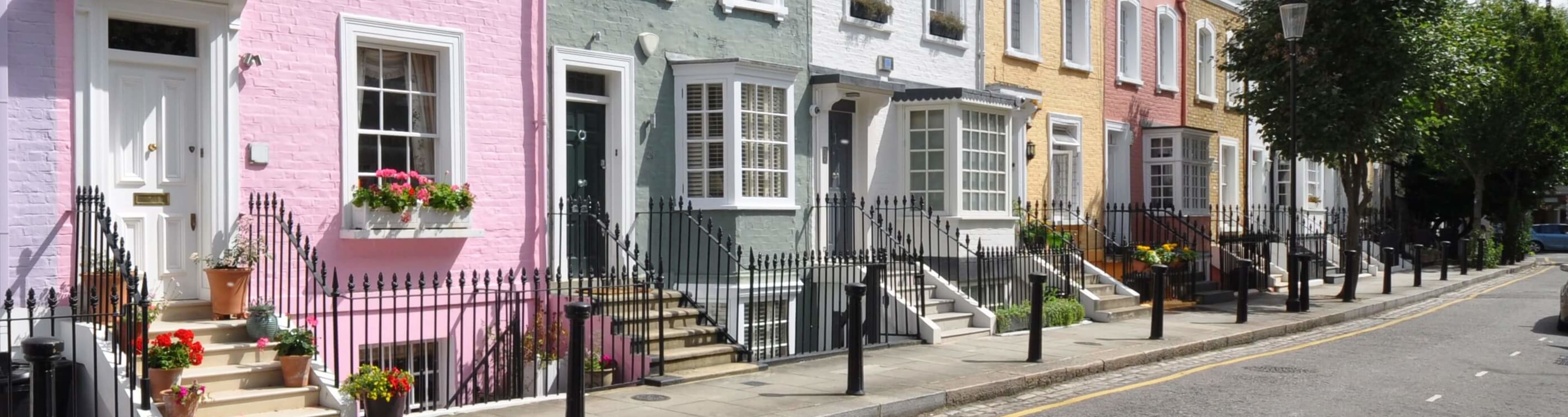 Pastel colored townhouses in a Chelsea mews