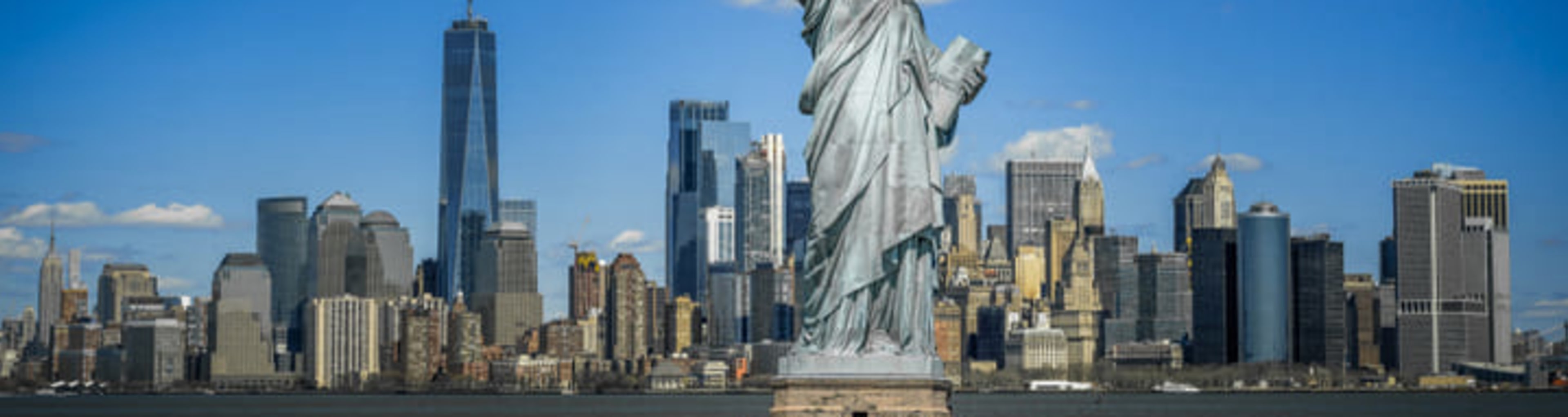 Statue of Liberty in front of the Manhattan skyline