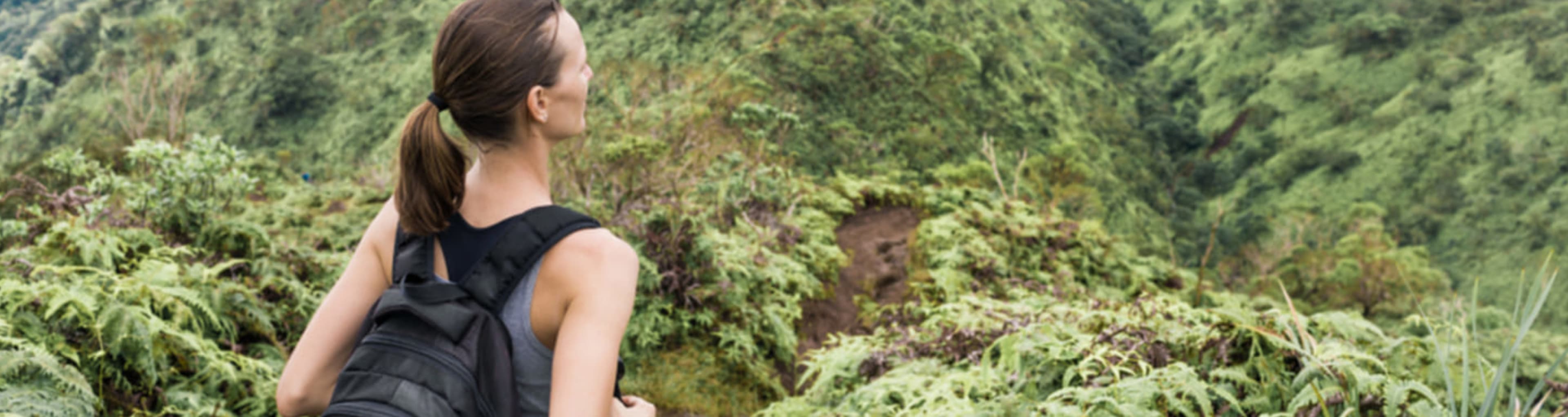 Hiker in the mountains of Oahu island, Hawaii.