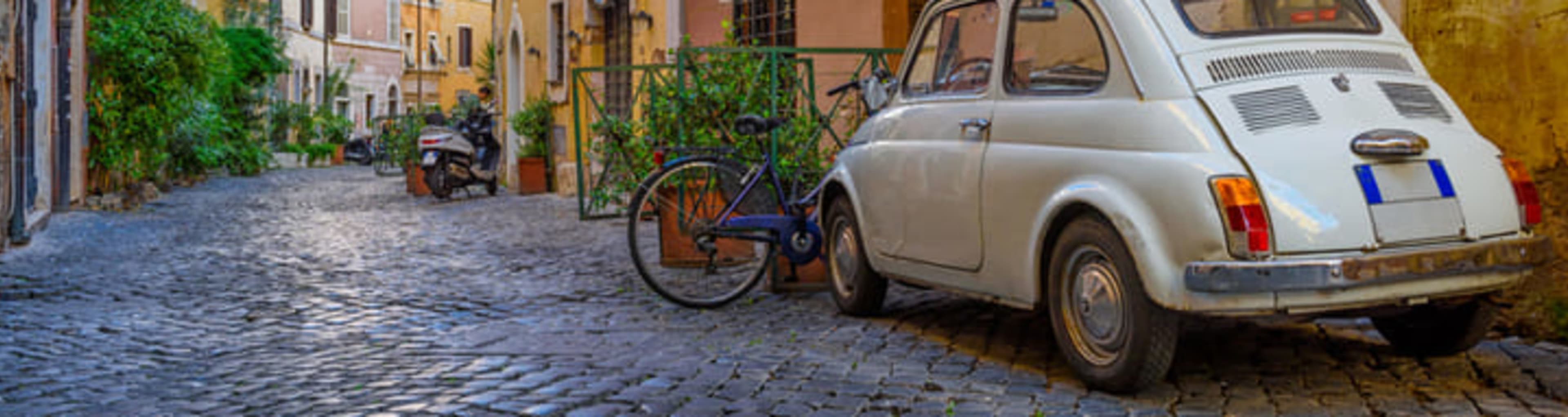 A cobbled street full of typical ocher-colored houses in Trastevere, Rome