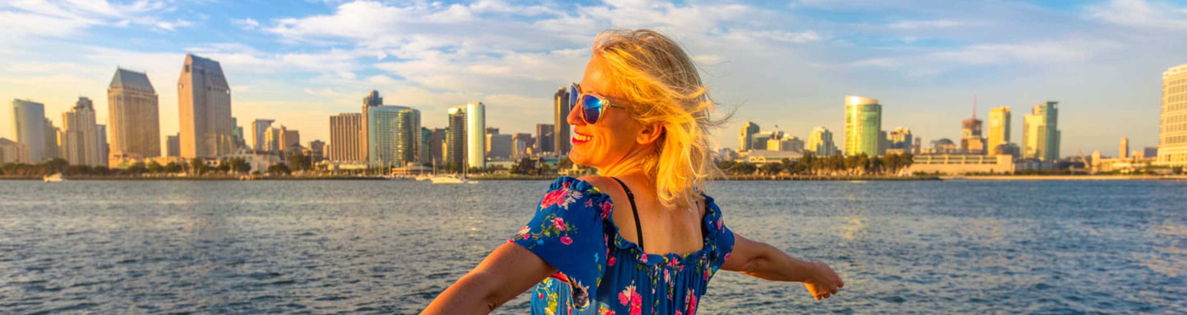 Woman looking across the water towards San Diego's skyline