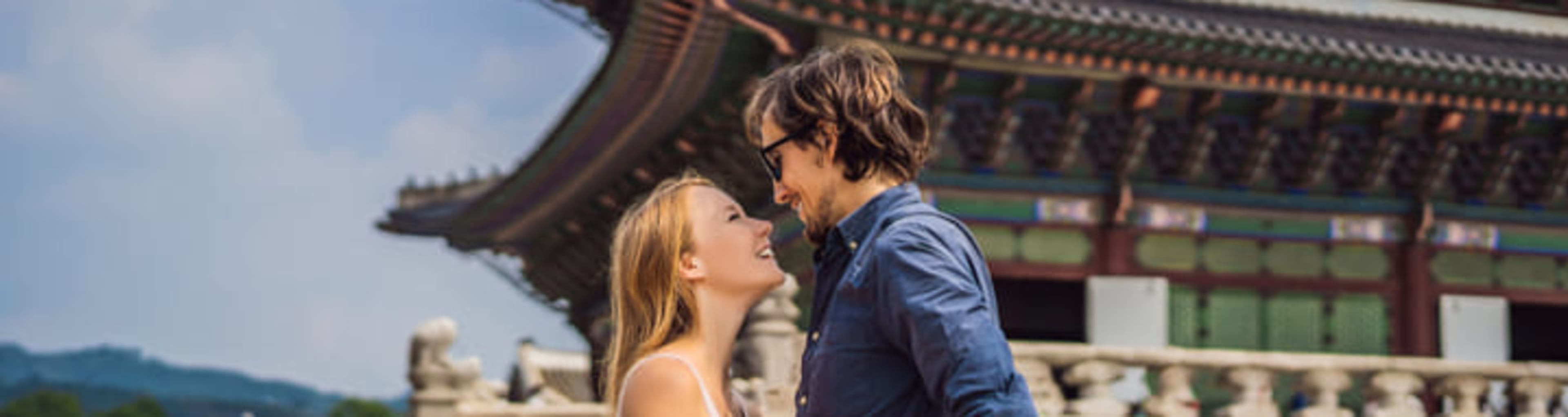 Young couple visiting a palace in Seoul.