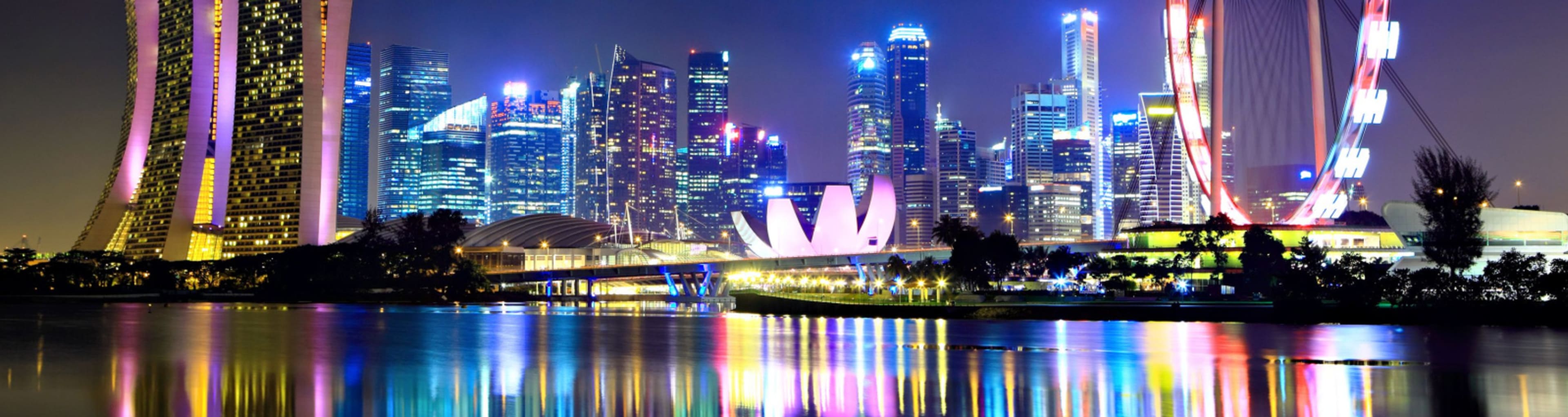 Singapore skyline at night with colored lights