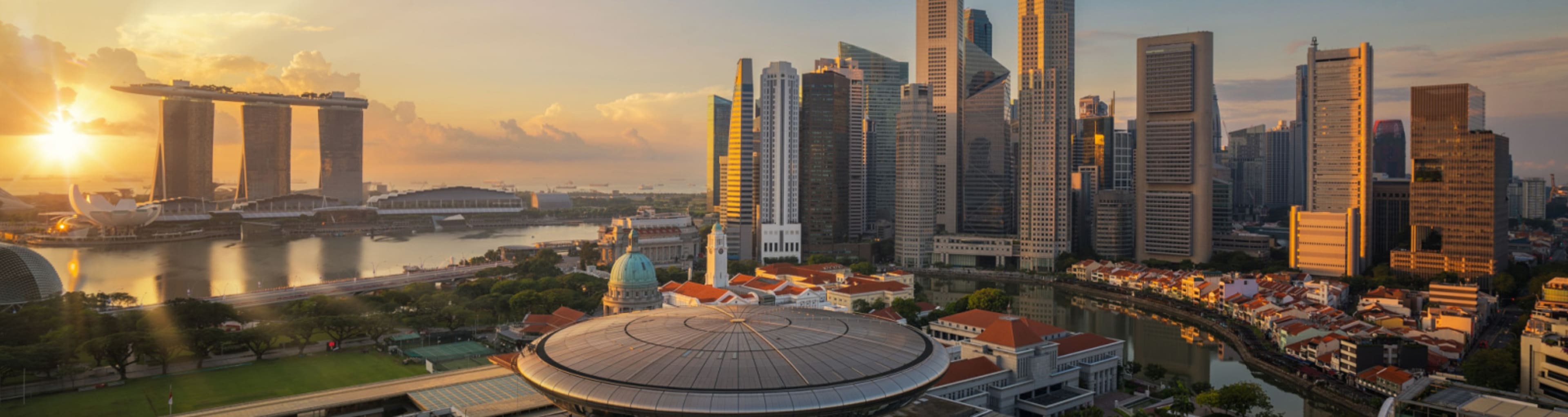 Vew of the Singapore Skyline with the sunrise in the background