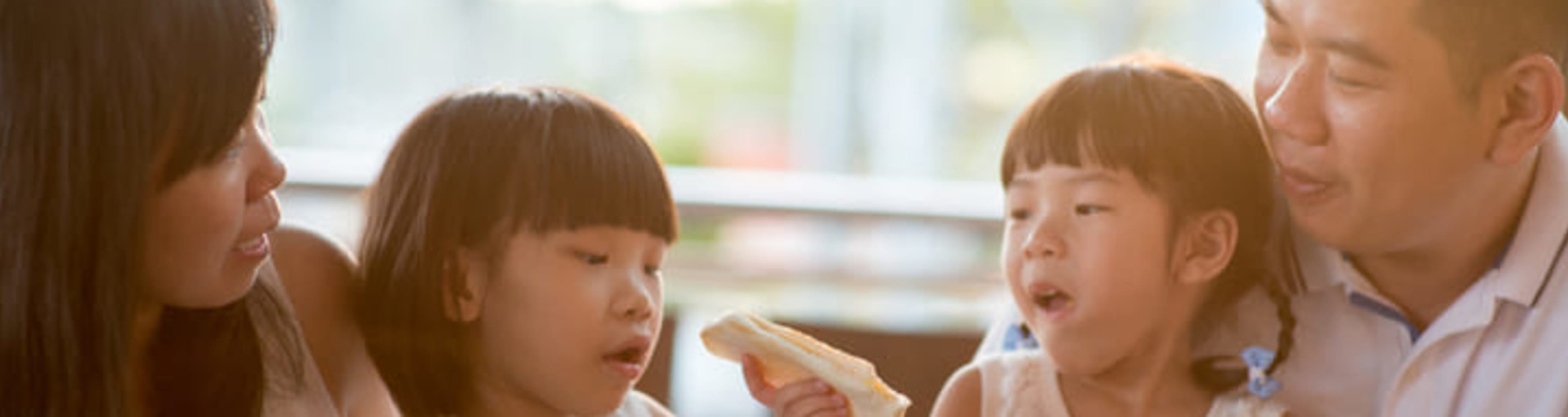 Young family eating lunch together