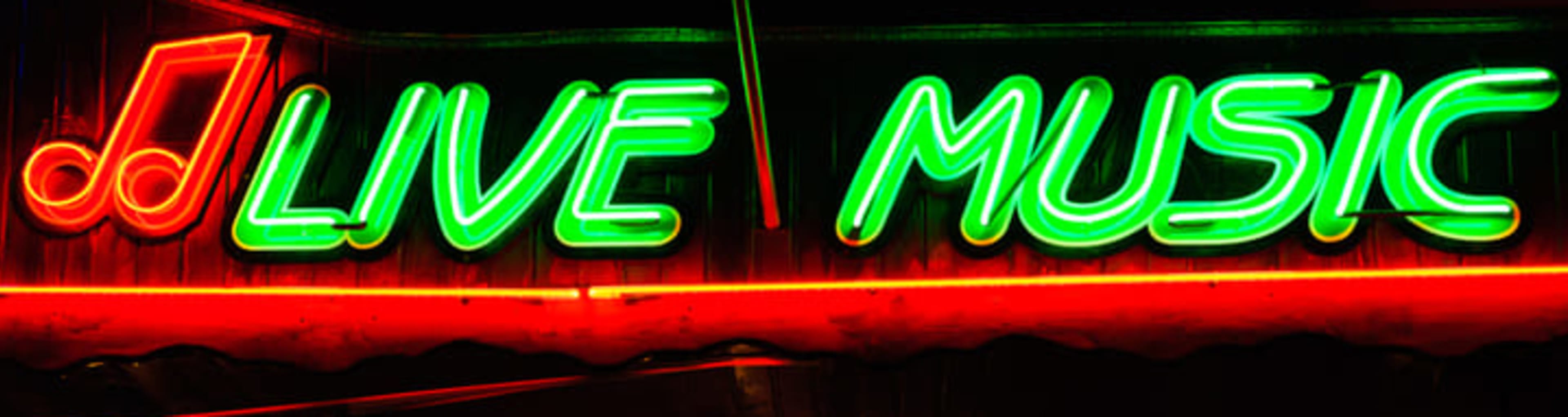 Neon sign advertising live music in green and red lights.