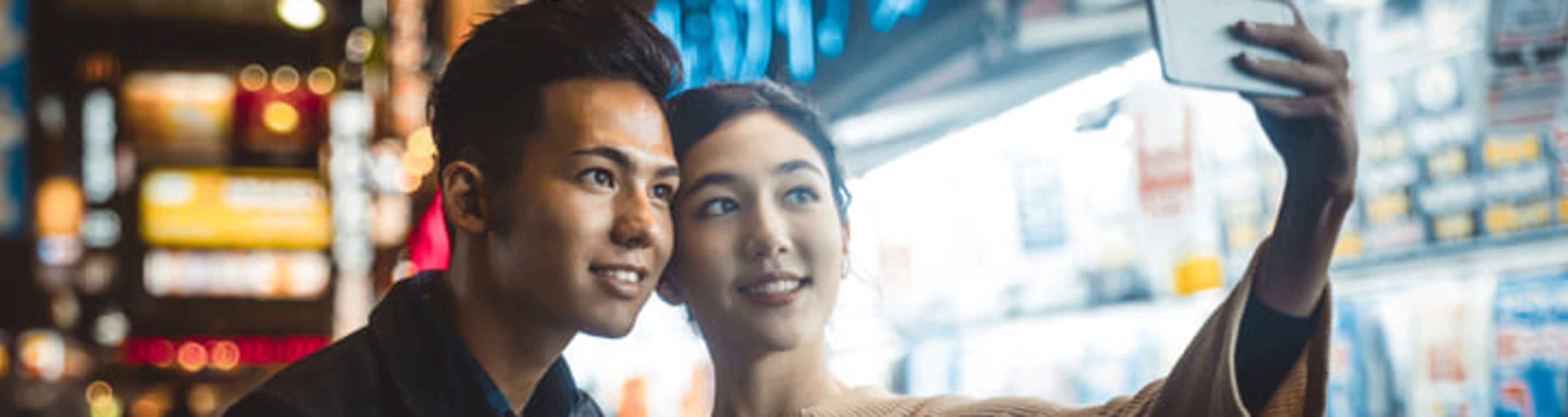 Young couple taking a selfie on a date in Singapore