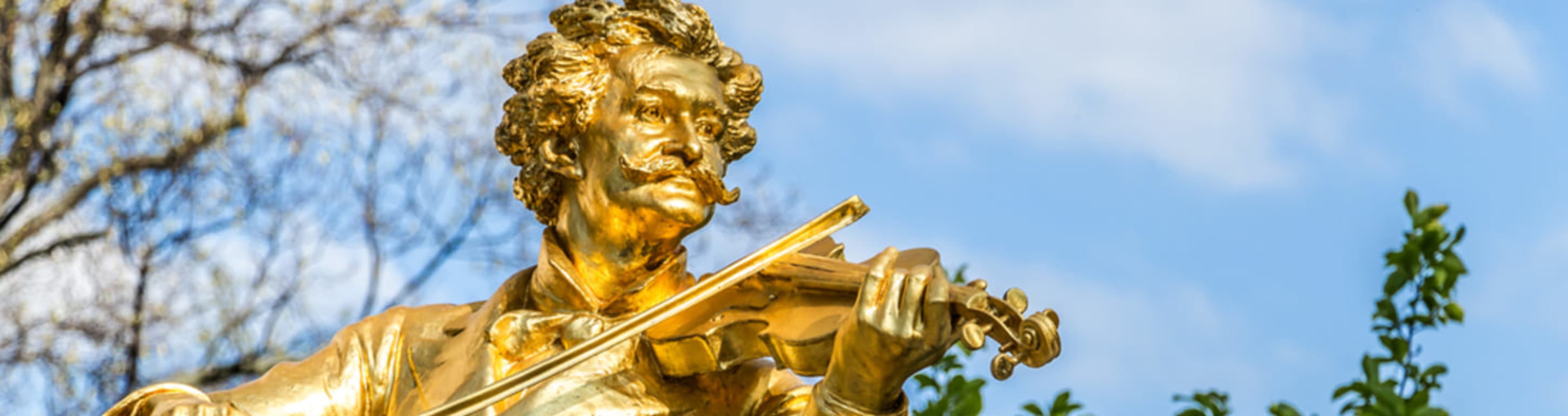 Golden statue of Johann Strauss II in Vienna's Stadtpark.