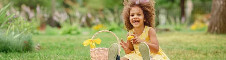 Little girl on a traditional Easter egg hunt.