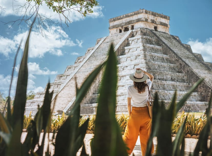 Woman tourist looking at Chichen Itza, Cancun