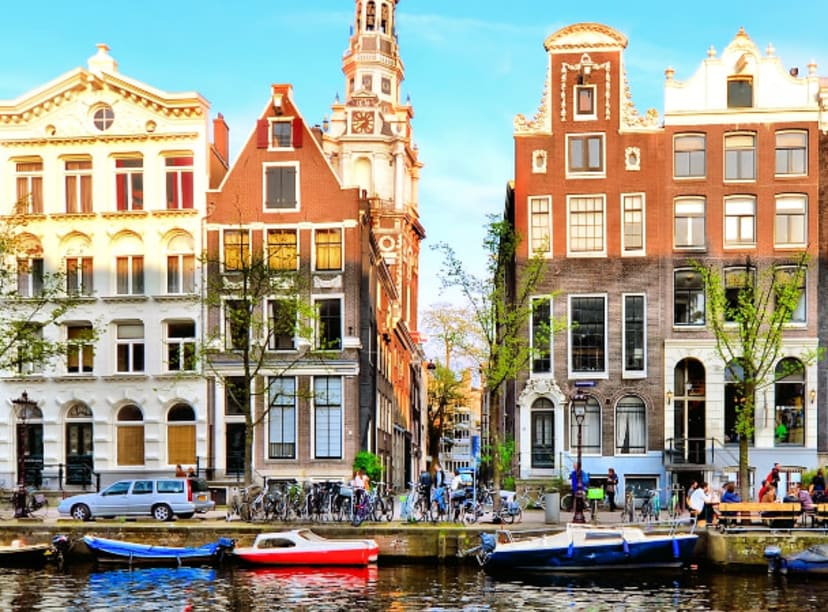 Iconic Amsterdam canal houses reflected in a canal