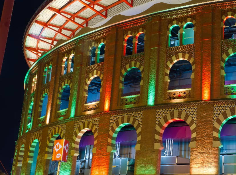 Las Arenas de Barcelona lit up colorfully in the evening