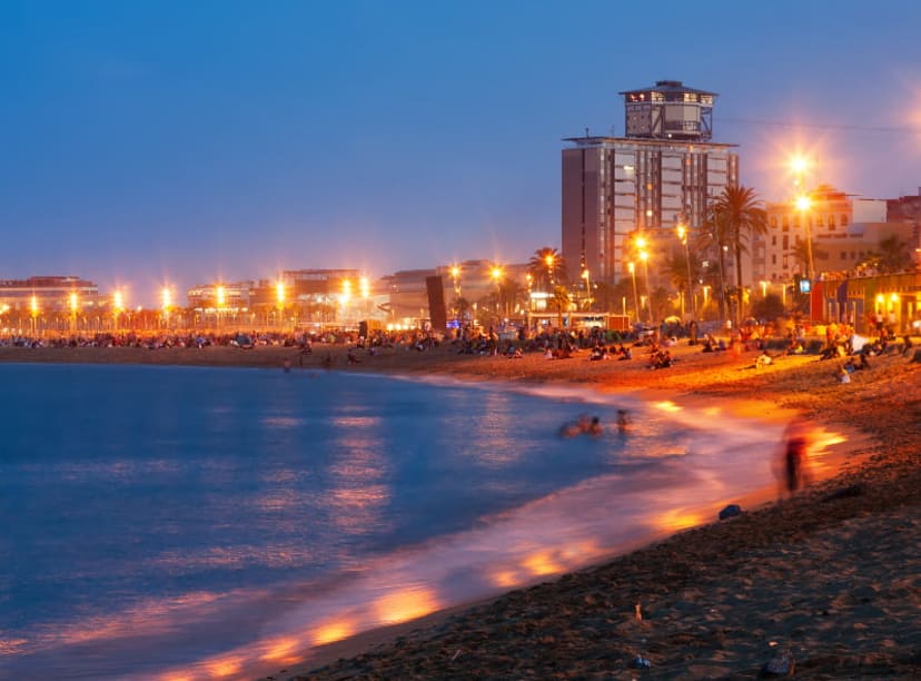 Barceloneta Beach lit up in the evening