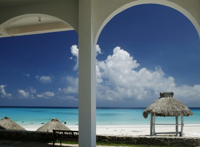 A Cancun beach framed by arches