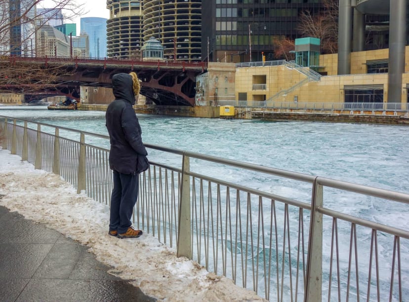 Someone takes in the frozen Chicago River