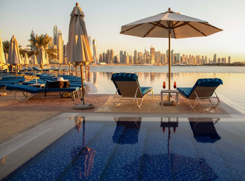 Sun loungers sitting empty on a Dubai rooftop terrace