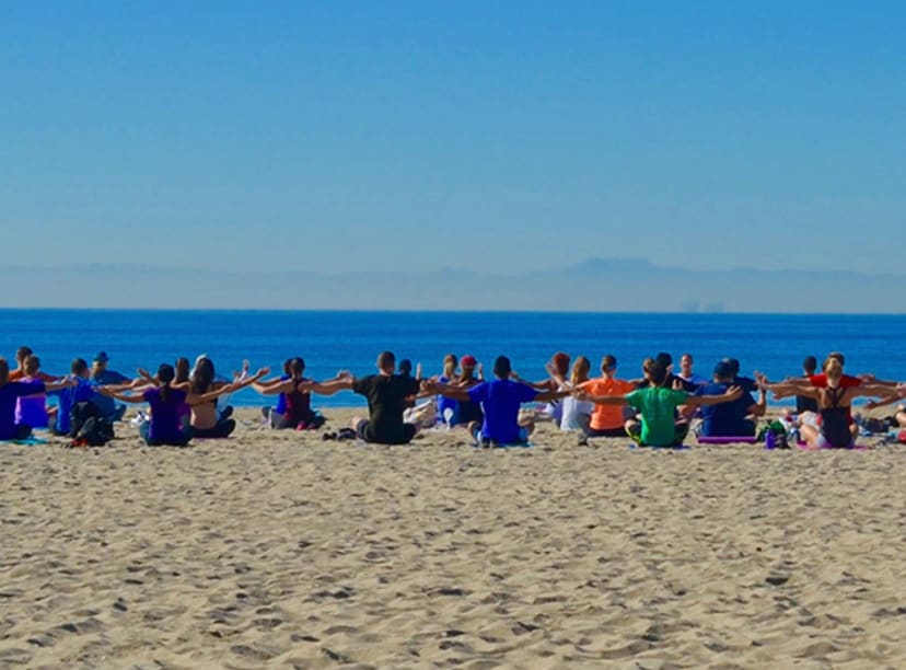 A yoga class on Huntington Beach, California.