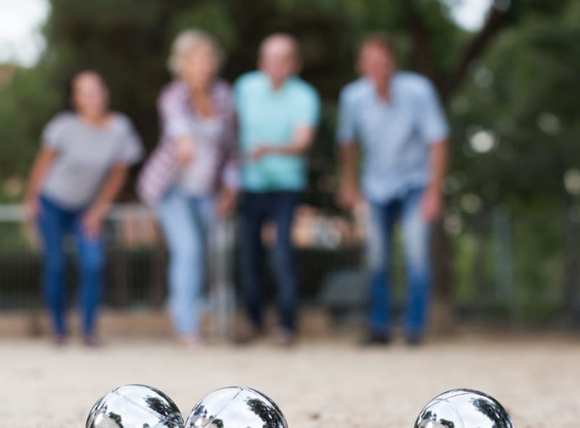 Family playing pétanque in Paris