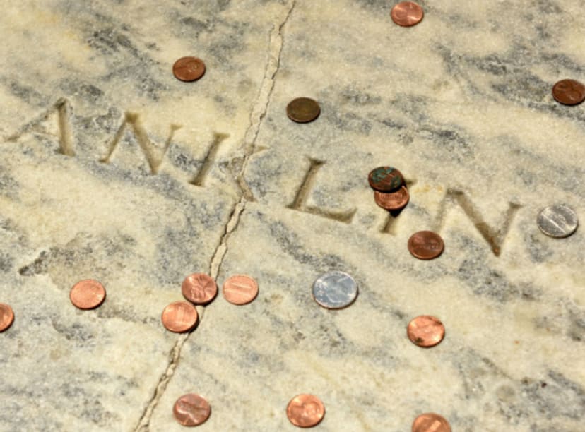 Benjamin Franklin's grave covered in pennies, one of the best outdoor activities in Philadelphia 