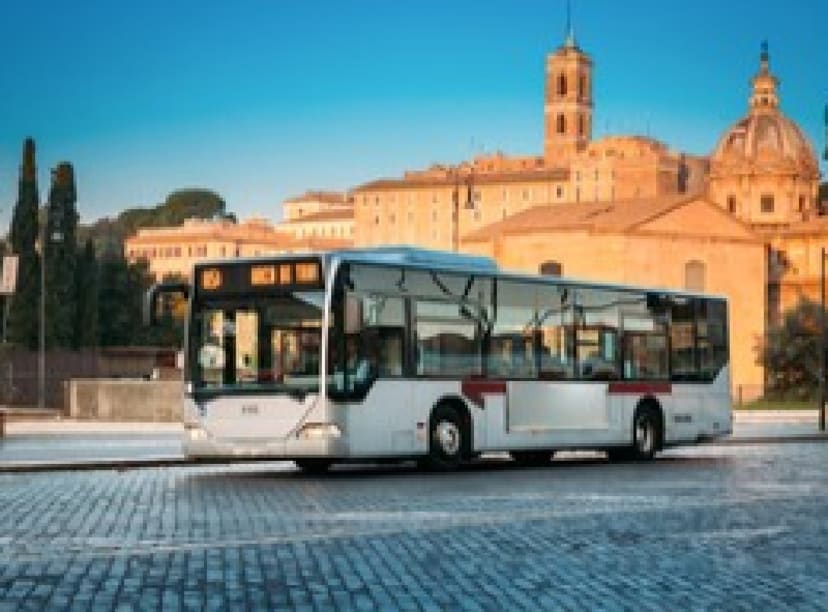 Public bus on a cobbled road in Rome