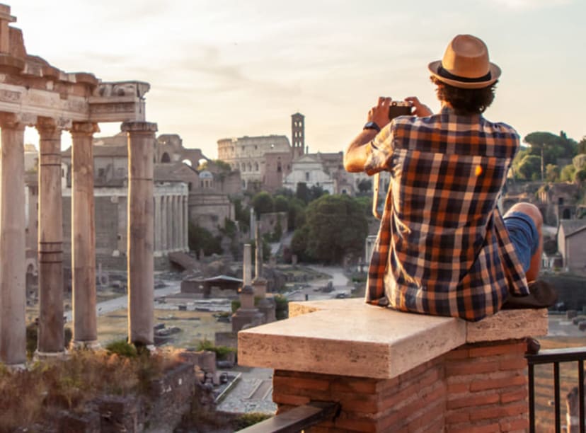 Man photographing the Roman Forum at dawn