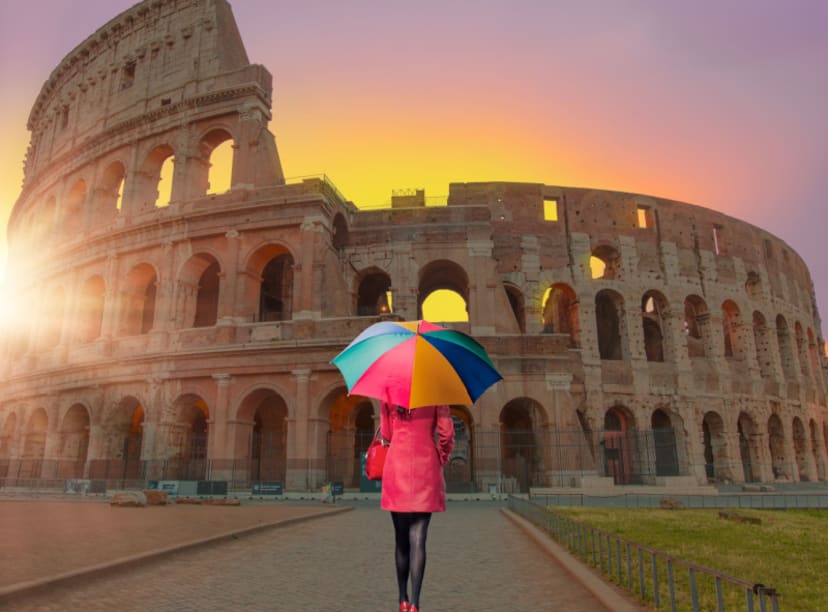 Woman in front of the Colosseum holding an umbrella