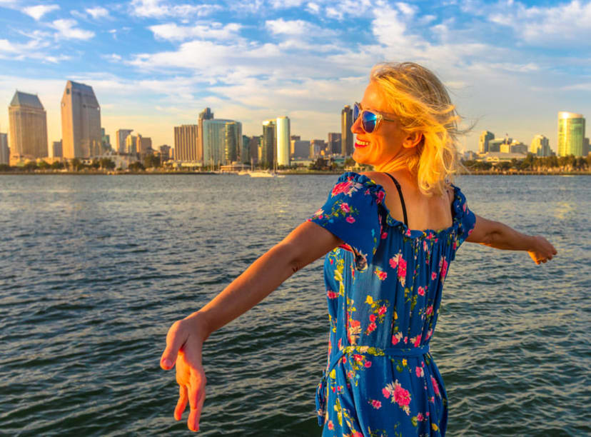 Woman looking across the water towards San Diego's skyline