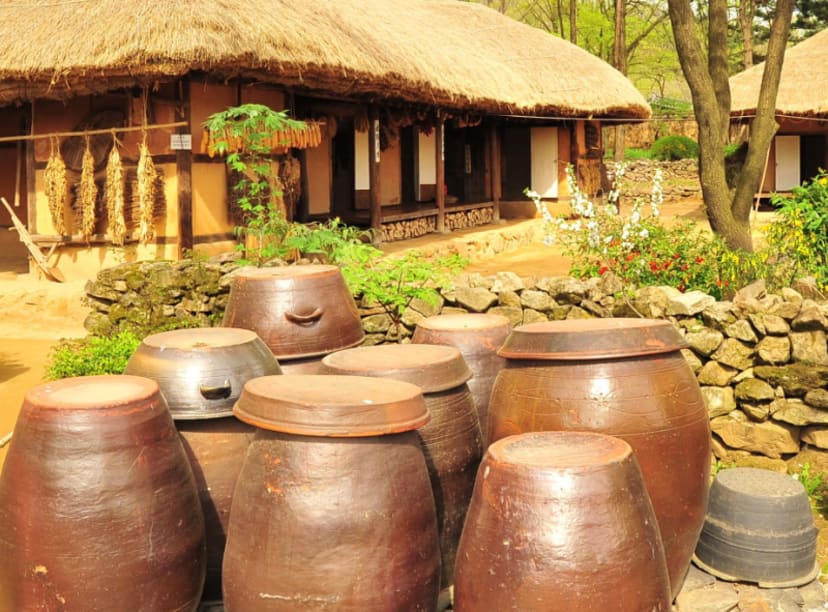 Barrels and a hut in a tradional Korean folk village