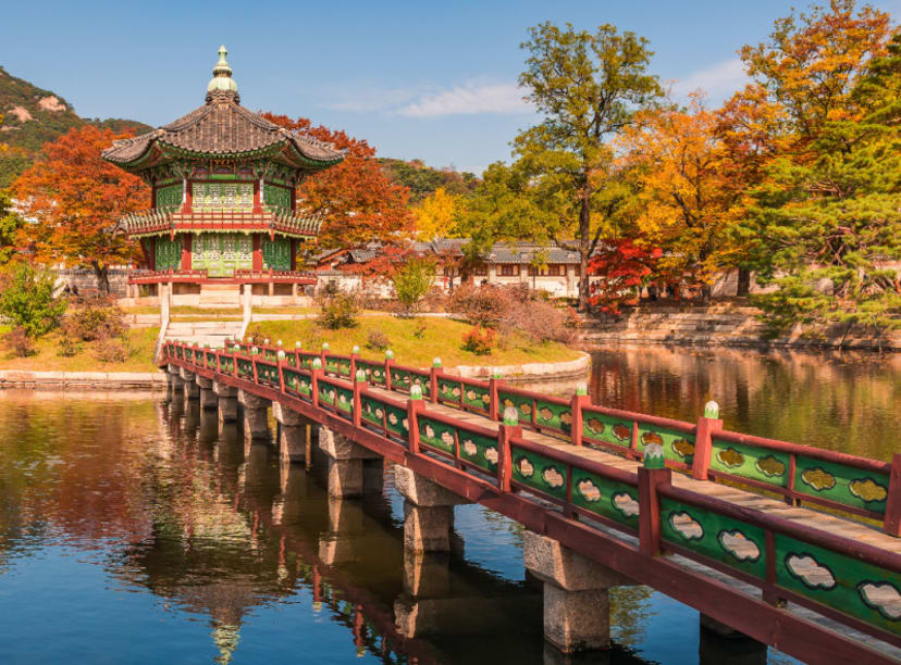 bridge leading to a pavilion by pond in Seoul